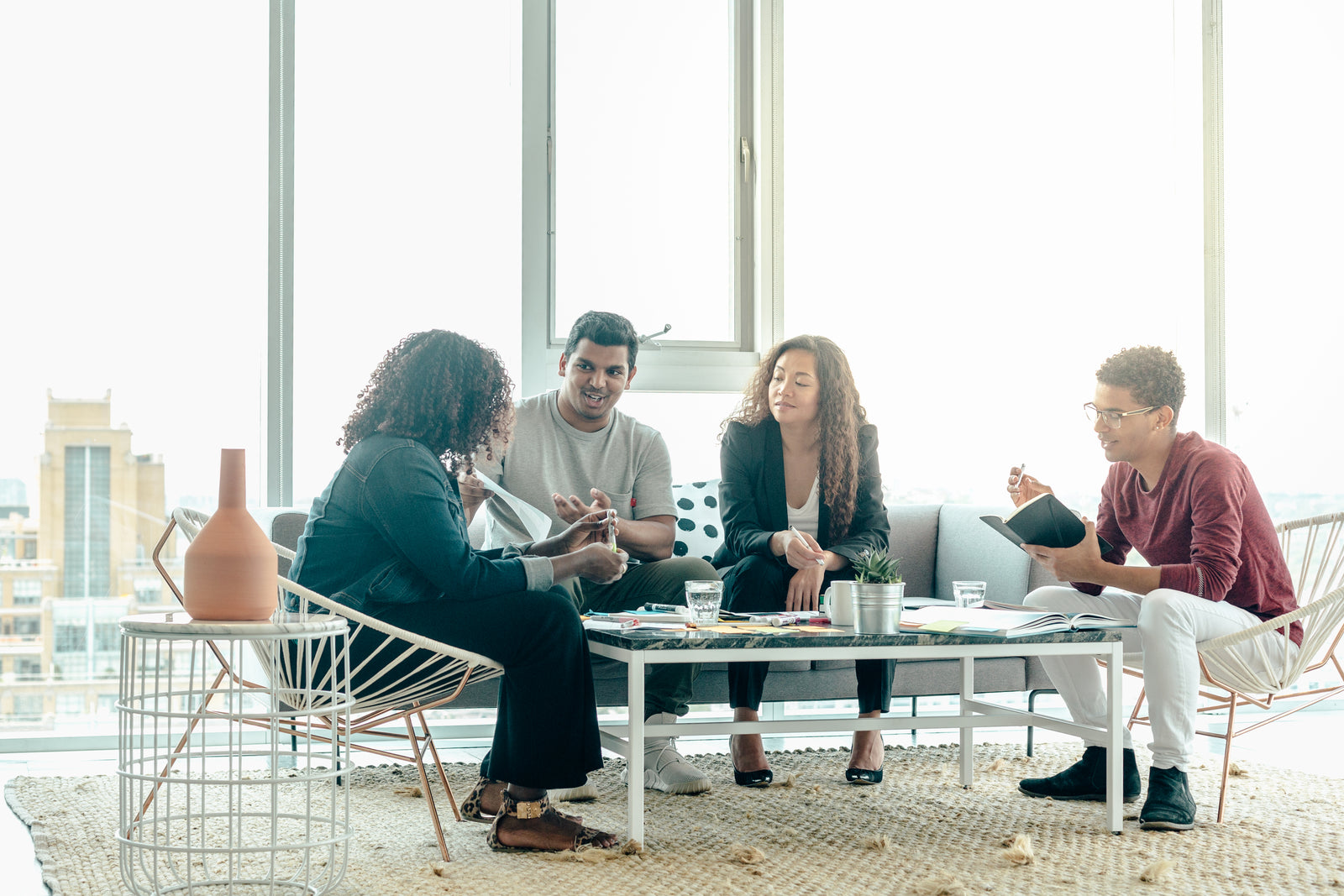 Illustrative stock photo of a team brainstorming in a bright office